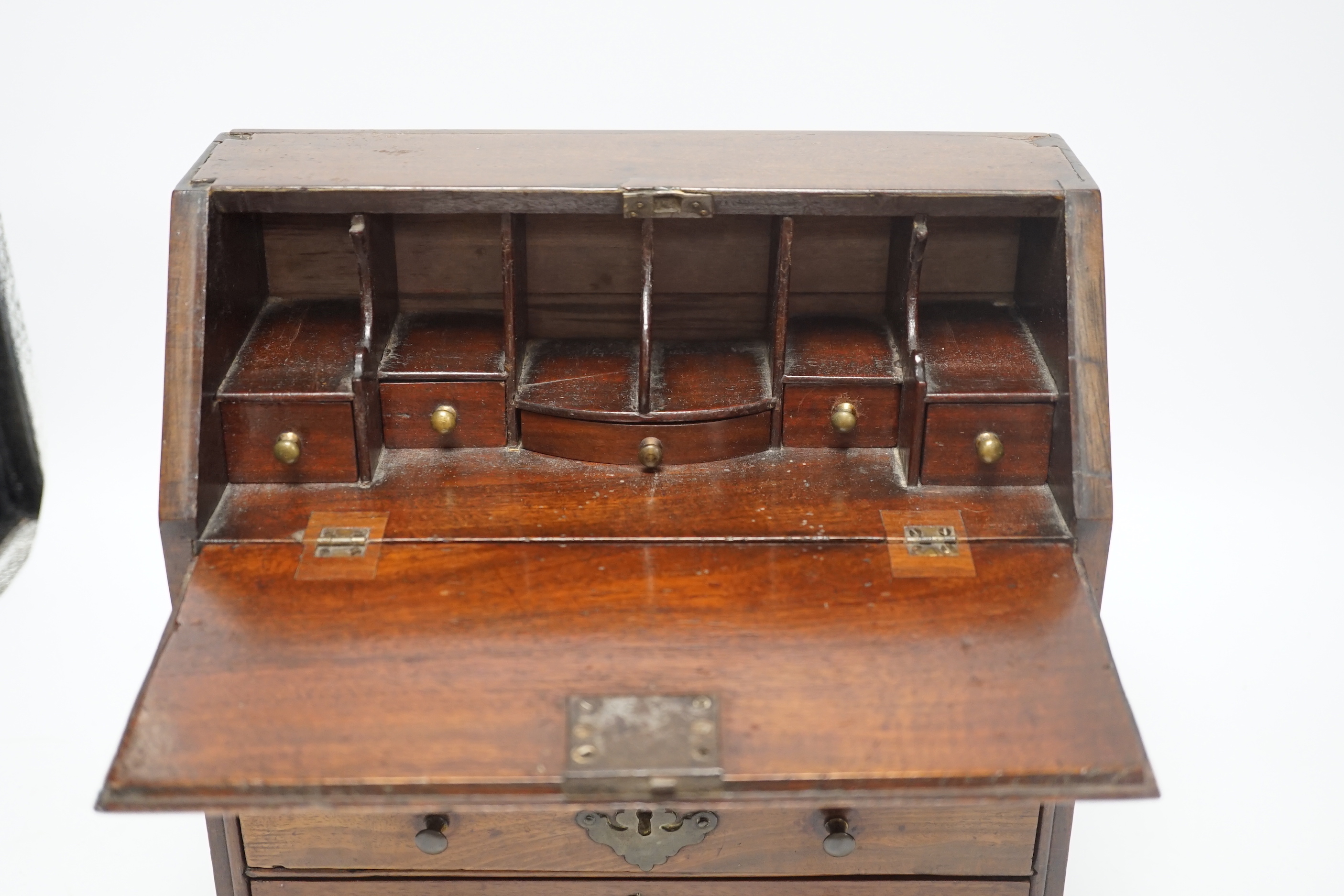 A George II miniature mahogany bureau with fitted interior and three drawers, 27cm high